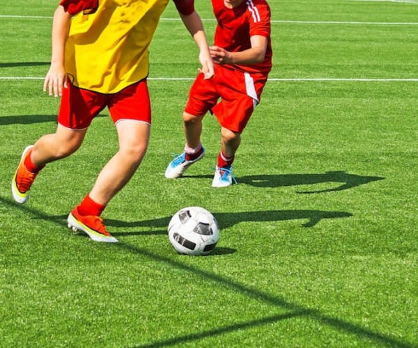 Young boys are playing soccer