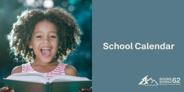 Picture of a girl holding a book.
