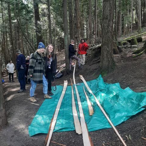 Goal 2 - RBSS Students participating in Cedar Stripping with Elders and community members.