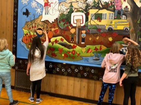 Students re-painted our mural to make it more representative of our diverse community.