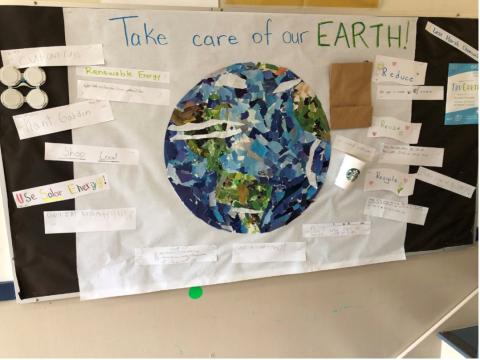 A poster with a large earth surrounded by handwritten suggestions for taking care of the planet.
