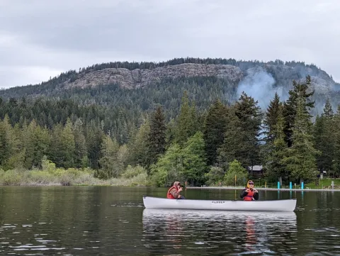 Two students in a canoe on a lake